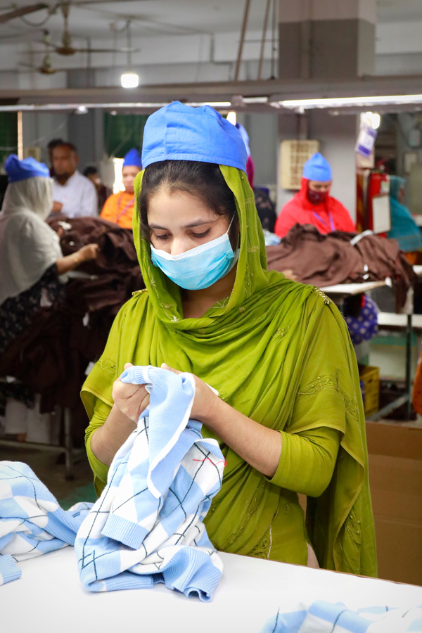Factory worker operating machinery in a manufacturing facility